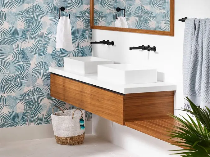 Clean white bathroom vanity with wood trim and white sinks - Weinstein Plumbing Supply West Chester