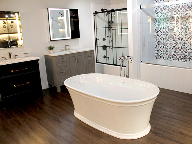 Free standing bathtub, shower doors and bathroom cabinents on display in the Weinstein West Chester Showroom